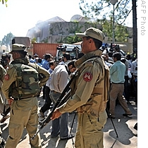 Pakistani paramilitary soldiers patrol in front of the United Nations office after a suicide blast in Islamabad, 05 Oct 2009