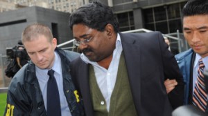 Raj Rajaratnam, billionaire founder of the Galleon Group, a major hedge fund, is led in handcuffs from FBI headquarters in New York Friday, Oct.16, 2009. Rajaratnam was charged with insider trading in the stock of several companies including Hilton, Clearwire, and Google. (AP Photo/ Louis Lanzano)